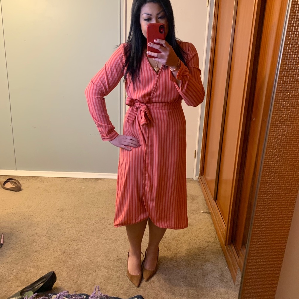 Long sleeve wrapped stripped dress.